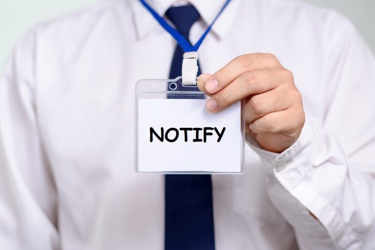Person Holding A Notify Card